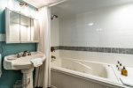 pedestal sink, mirror, jetted bath tub, shower